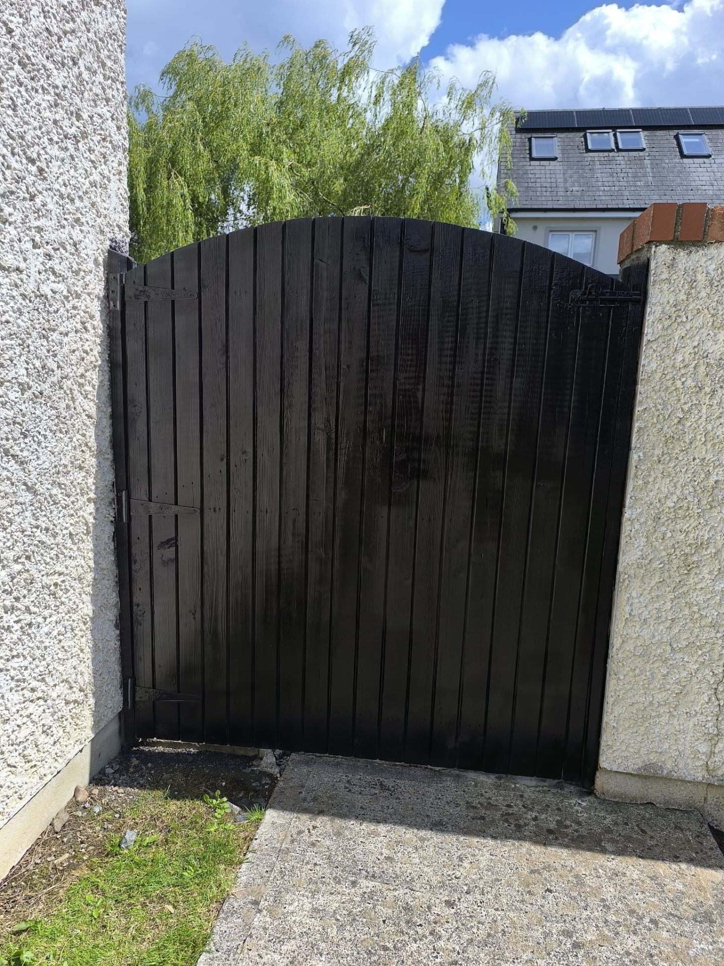 Same gate freshly painted glossy black